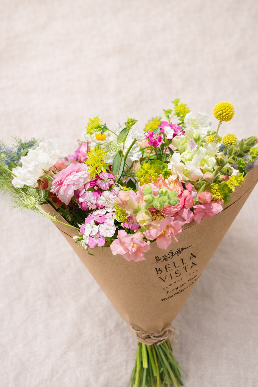 hand tied bouquet of local farm flowers simple natural arrangement