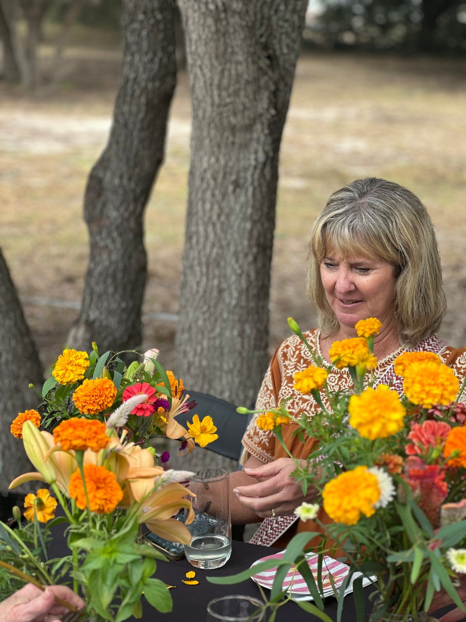 Participant creating floral arrangements during an on-farm workshop