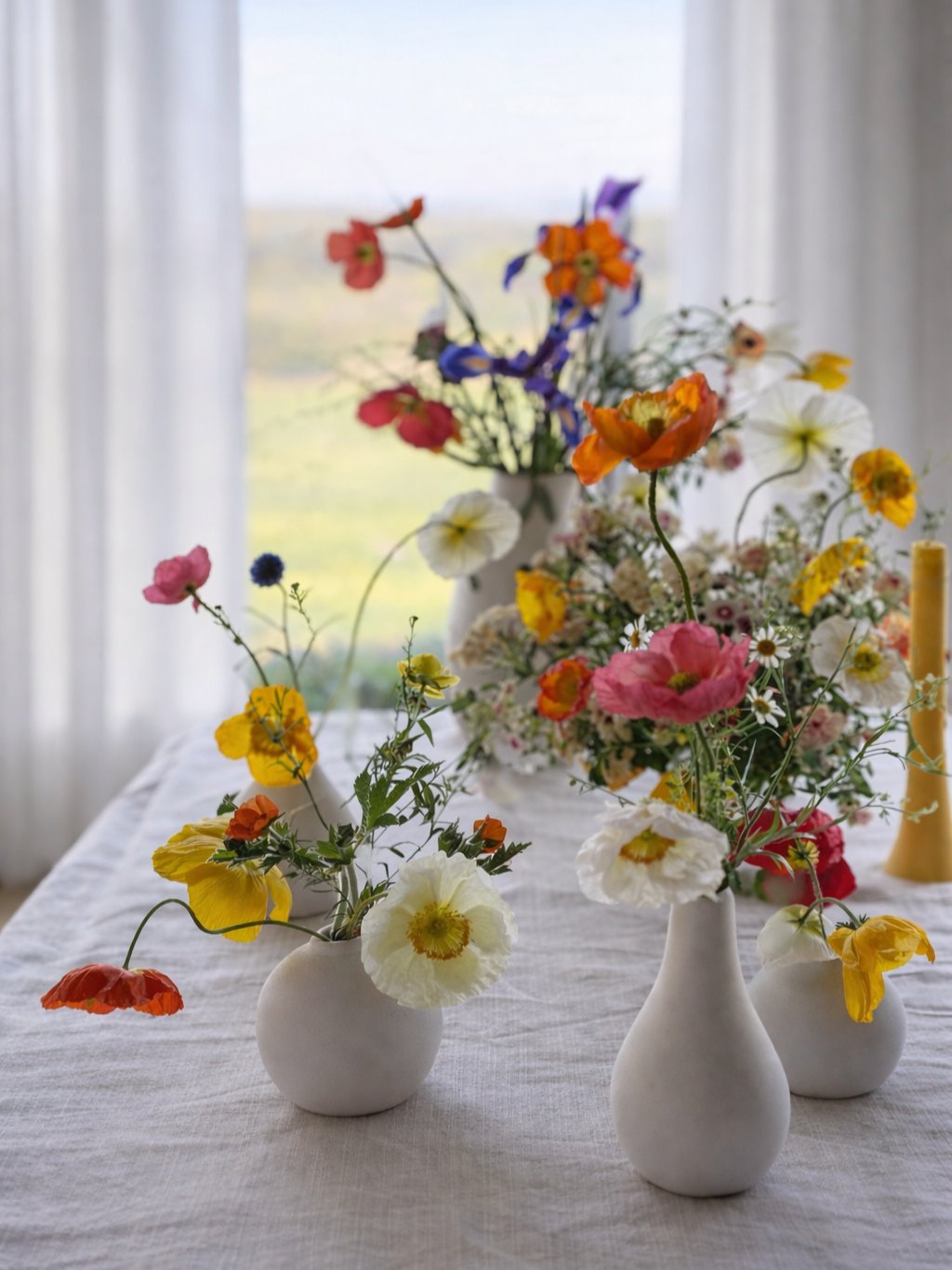 spring table with multiple small flower arrangements hosting setup Texas