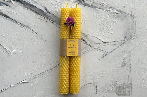 Pair of beeswax taper candles with natural golden color