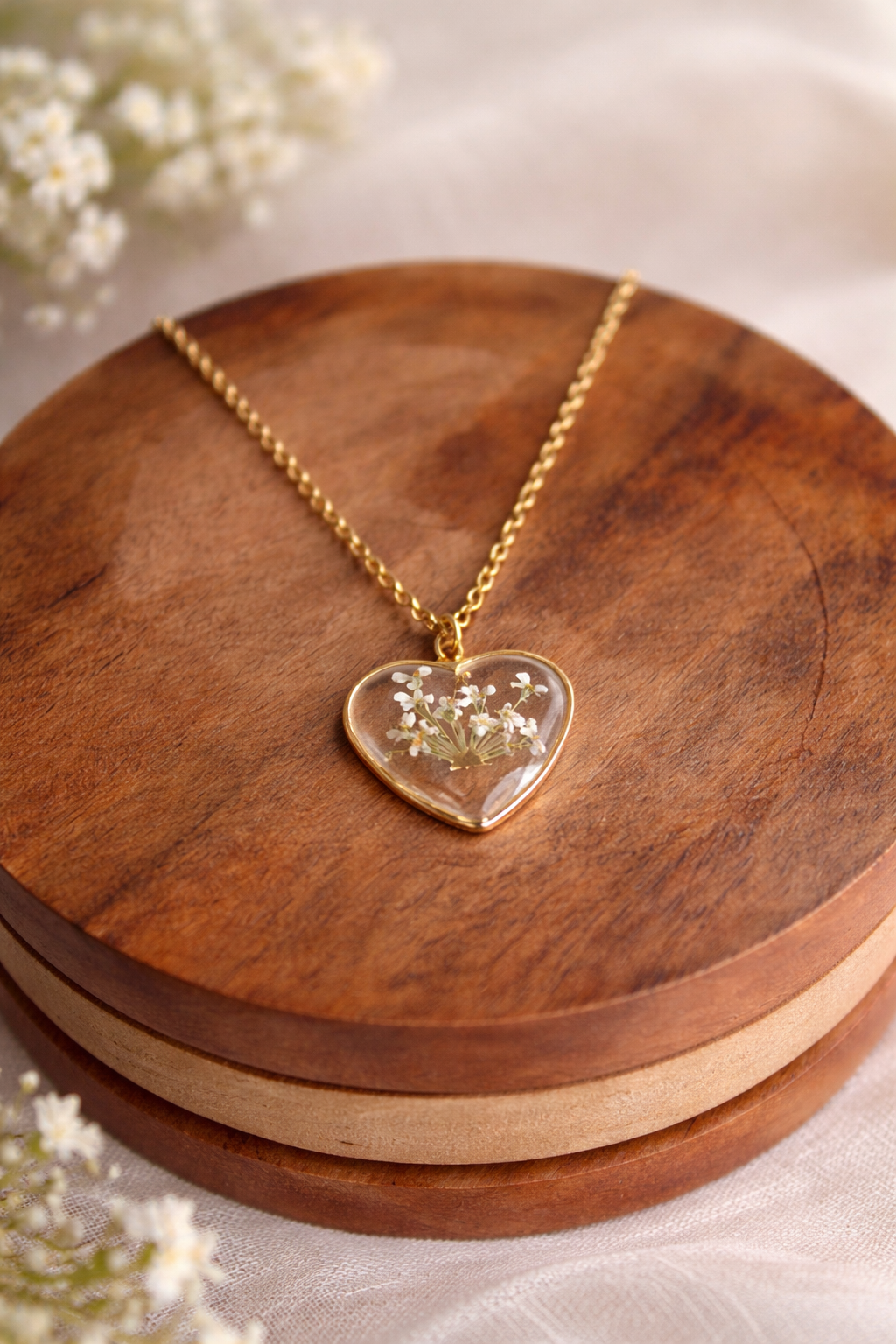 Pressed flower necklace featuring a real flower preserved in resin