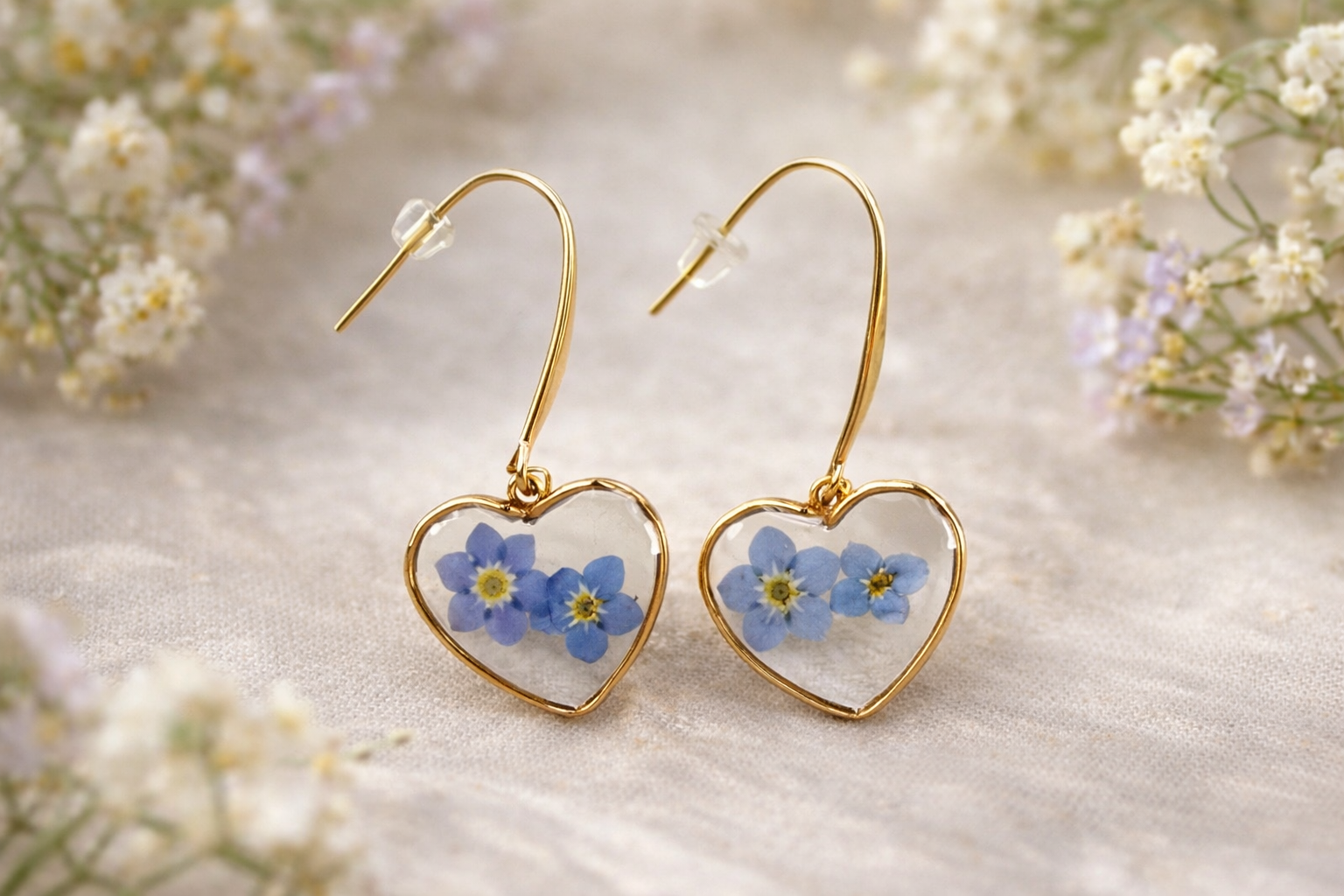 Pressed flower earrings featuring real flowers preserved in clear resin