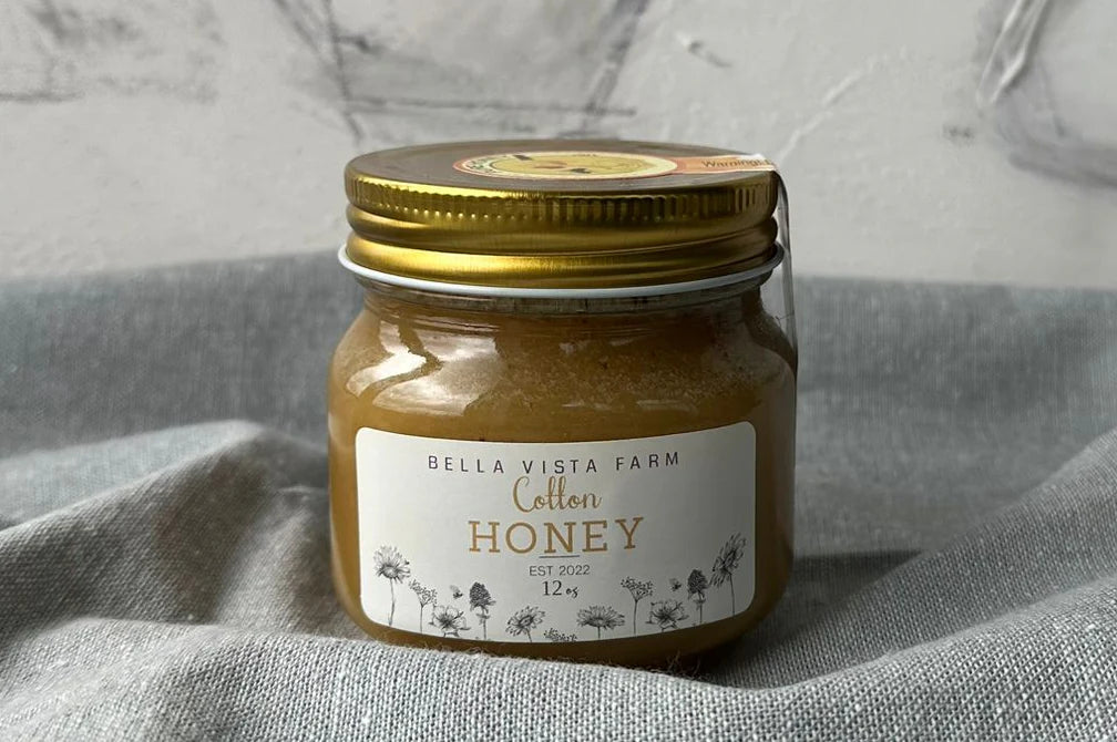 Jar of cotton honey produced from cotton plant blossoms in Texas
