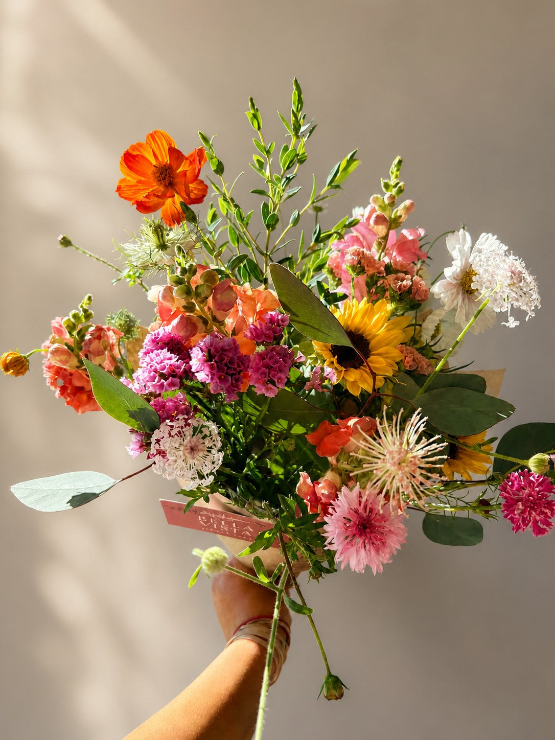 Garden-style bouquet with seasonal Texas flowers for summer gatherings